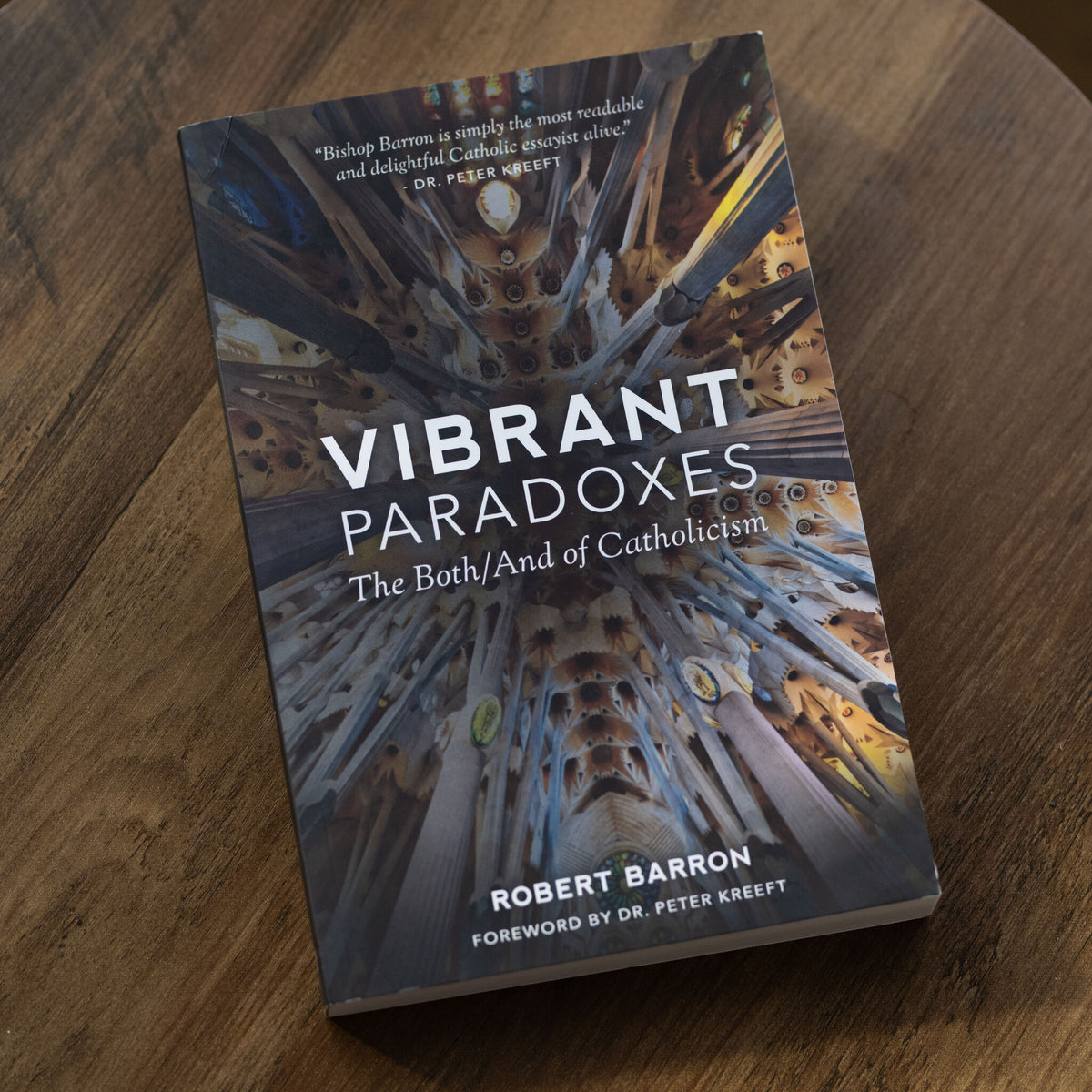 Paperback edition of Vibrant Paradoxes: The Both/And of Catholicism by Robert Barron with foreword by Dr. Peter Kreeft, featuring a detailed photo of a cathedral ceiling for spiritual growth and evangelization, books on Catholicism, paperback 9781943243105