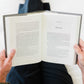 Person holding an open book titled An Ocean Full of Angels, by Peter Kreeft, Catholic fiction novel, Word on Fire Luminor, hardcover 9781685783075