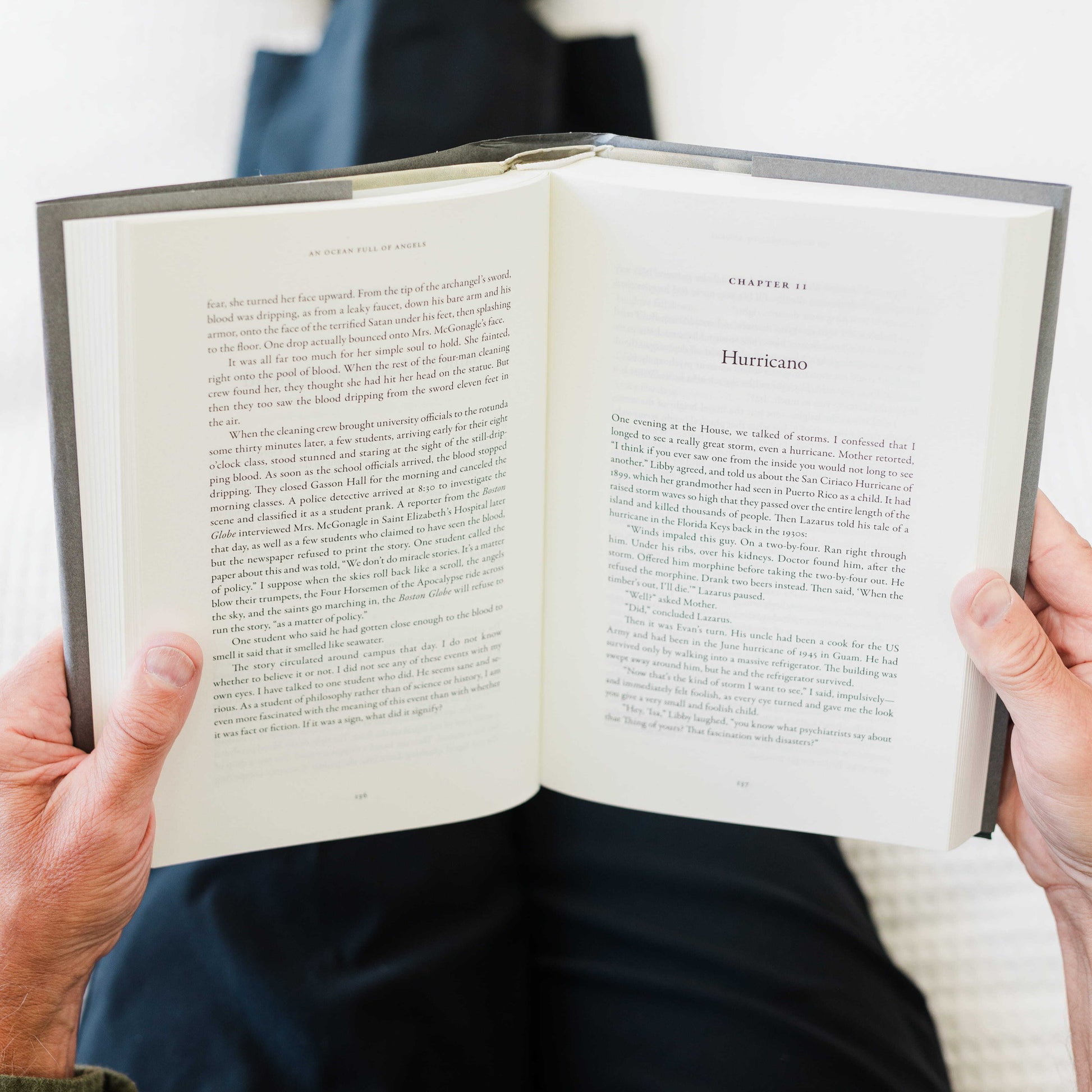 Person holding an open book titled An Ocean Full of Angels, by Peter Kreeft, Catholic fiction novel, Word on Fire Luminor, hardcover 9781685783075