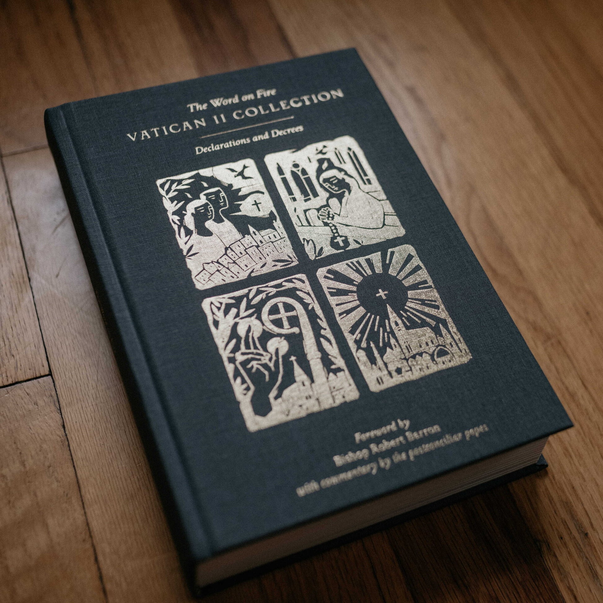 The Word on Fire Vatican II Collection: Declarations and Decrees book with a dark cloth cover featuring gold embossed religious illustrations, contributors include gid://shopify/Page/92849438777 and gid://shopify/Page/92850126905.